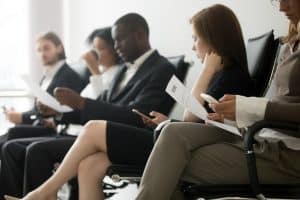 random business people sitting and reading